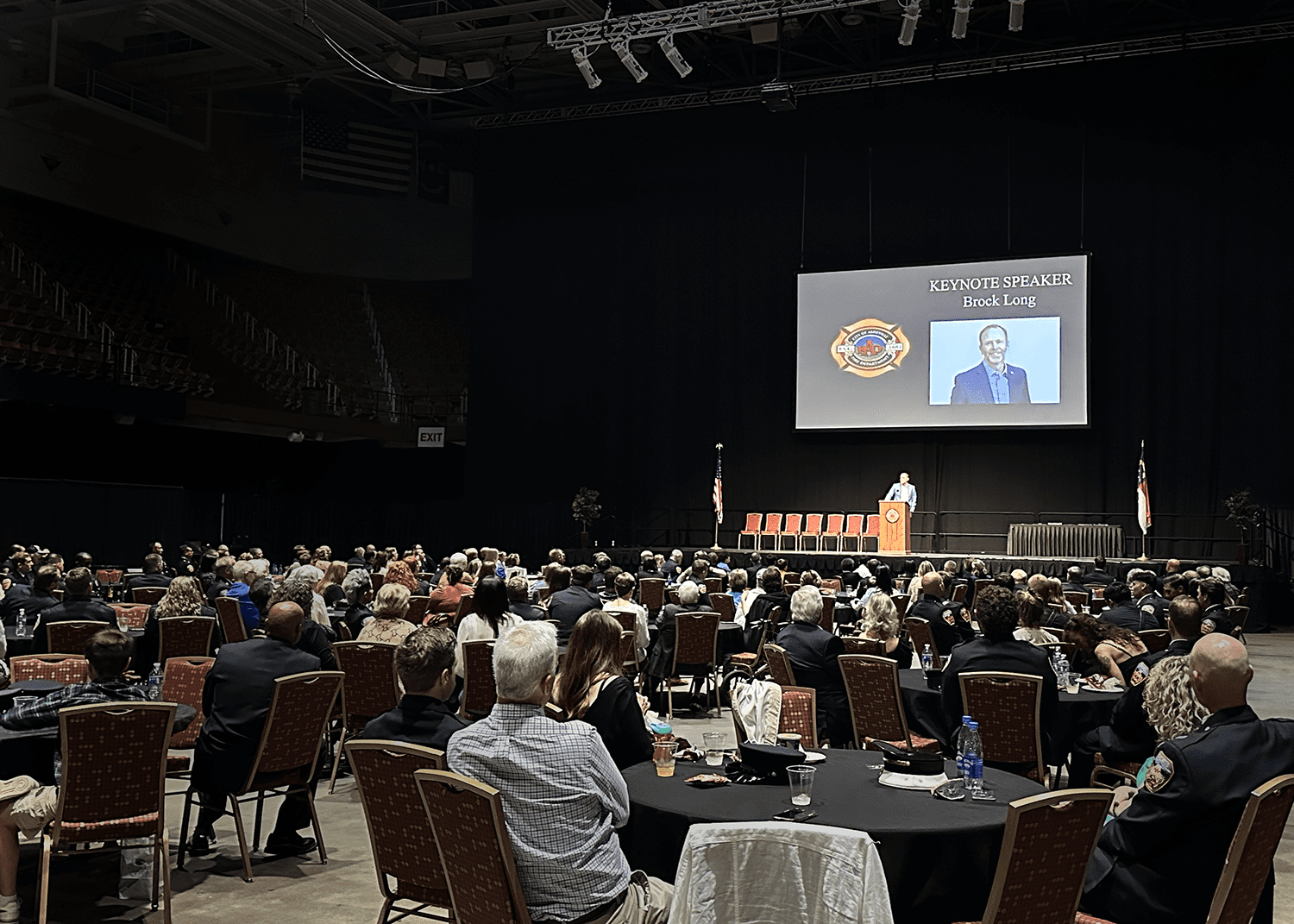 Brock Long speaking to an auditorium of first responders and firefighters at the Asheville Fire Department's annual awards ceremony.